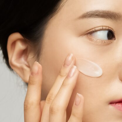 korean woman are applying cream on her face